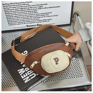 Close-up of kids chest bag with embroidered P letter and adjustable buckle strap