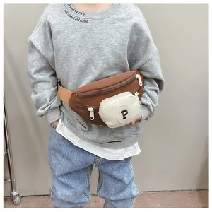 Detail showing the brown kids' chest bag with a mini P-letter pouch and durable zippers