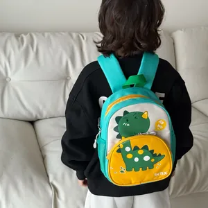 Zaino per bambini con simpatico dinosauro e pannelli a contrasto verde e giallo