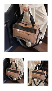 Detailed view of spacious khaki travel bag with shoulder strap in real life settings