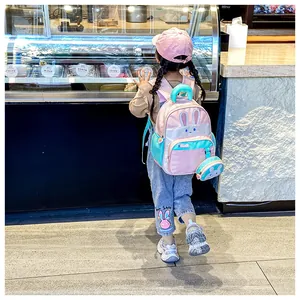 Pink bunny backpack for kids with 3D ears and matching mini rabbit coin purse pendant