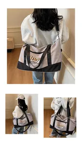 Three-way view of large capacity travel duffel bag with handles and adjustable strap