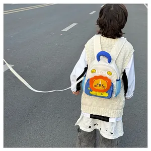 Detail of toddler safety backpack with lion pattern and anti-lost leash attachment