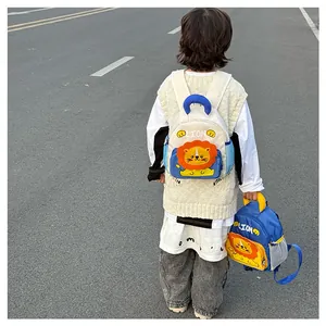 Detail view of lion toddler backpack with side mesh pocket and cartoon lion design
