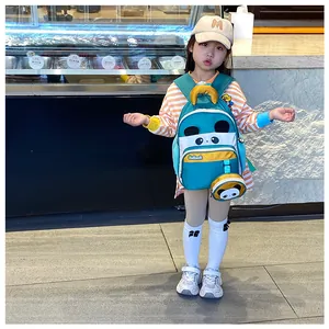 Detail of blue cartoon panda backpack for kids featuring small round coin purse attachment