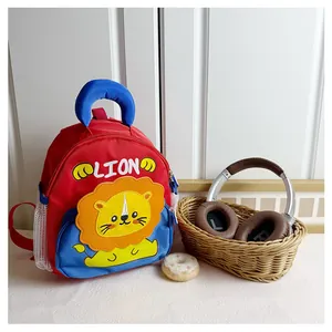 Detail of red and blue lion backpack with mesh pockets and sturdy top handle