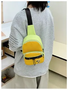 Detail shot of the adjustable black strap and buckle on the neon yellow crossbody bag