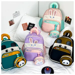 Detail of cute animal kids backpacks with matching mini coin purses in four colors