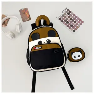 Detail view of cartoon panda backpack with matching coin purse and stylish bear ear design