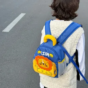 Cute cartoon lion toddler backpack in blue and yellow colors shown on a child outdoors