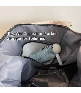 Detail of travel bag showing wet and dry separation pocket for storage and toiletries