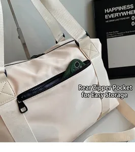 Detail of travel bag back zipper pocket for storage with green phone inside