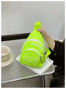 Detail of neon green nylon chest bag featuring letter print and gesture icons