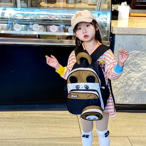 Cute cartoon panda backpack for kids featuring multi-layer storage and a small round pouch