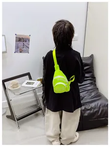 Rear view of a neon green canvas crossbody chest bag for kids with white letter print