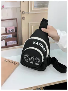 Detail view of black canvas chest bag with white letter print and adjustable strap