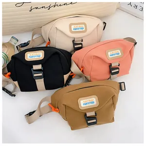 Close-up of four canvas waist bags in beige, black, pink, and tan with plastic buckles