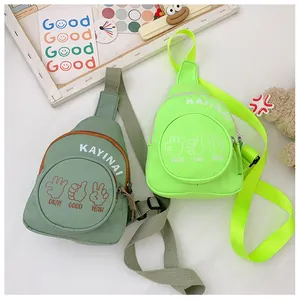 Detail of canvas crossbody bags with letter prints and adjustable straps for kids