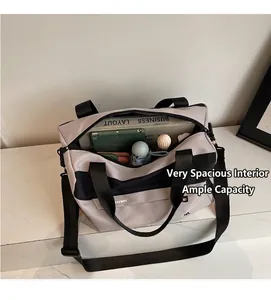 Top view of large capacity travel bag showing spacious interior with tablet and daily items