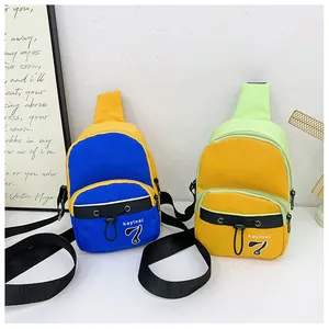 Detail view of mini crossbody chest bags with elastic drawstrings and adjustable straps