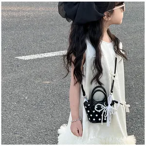 Polka dot crossbody bag with pearl bow and lace charm for girls in outdoors
