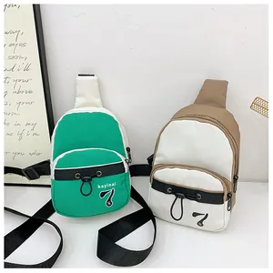 Detail of trendy color-block crossbody bags with adjustable straps and nylon texture