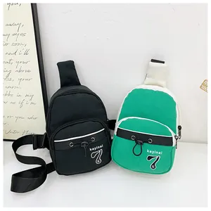 Detailed close-up of nylon mini crossbody bags in black and lime green with front pockets
