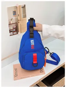 Detail of blue kids chest bag with orange accents and adjustable wide shoulder strap