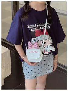 Close-up of white PU leather crossbody bag with pink plaid bow and cat embroidery