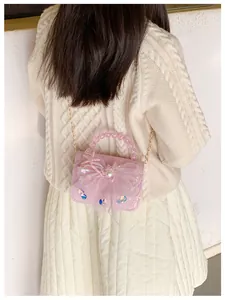 Detailed view of pink lace crossbody bag with starfish charms and pearl handle