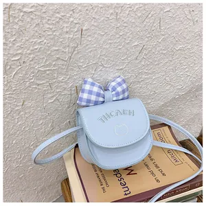 Mini light blue kids crossbody bag with a blue checkered bow and cute cat embroidery