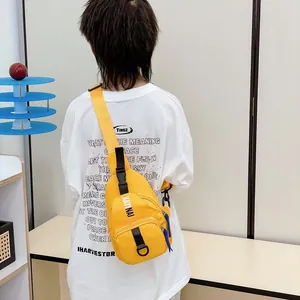 Youthful bright yellow crossbody chest bag for kids with adjustable strap and brand logo
