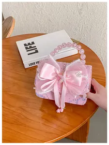 Sac à main rose à paillettes pour fille avec nœud en satin et anse perlée sur bois