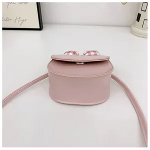 Pink mini PU crossbody bag with red gingham bow detail and metal magnetic closure