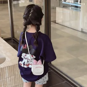 Toddler navy t-shirt with cartoon back print, polka dot shorts and bow crossbody bag