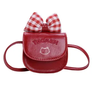 Mini red crossbody bag for girls with checkered bow and cute cat pattern on white background
