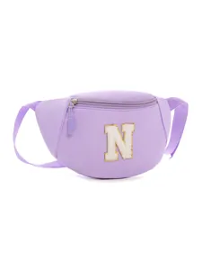 Close-up of purple kids fanny pack featuring white towel embroidered N letter patch