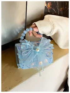 Détail du sac à main bleu clair pour filles avec paillettes, nœud en tulle et étoile