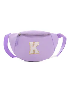 Detail view of lavender purple kids chest bag with plush letter K and gold glitter border