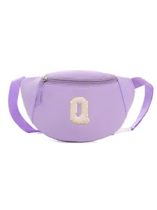 Close-up of purple children fanny pack featuring a sequined letter Q embroidery patch
