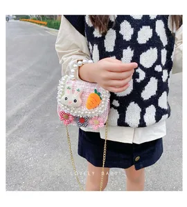 Pink tweed kids crossbody bag with 3D bunny carrot patches and pearl handle detail