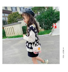 Pink tweed children's crossbody bag with pearl handle and cute rabbit decorative detail