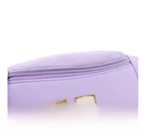 Detail shot of the purple kids waist bag featuring an embroidered letter N patch