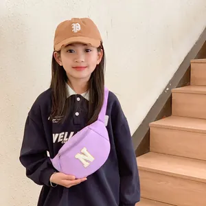 Fashionable purple kids chest bag with letter N patch and adjustable shoulder strap