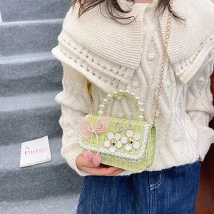 Girls tweed crossbody bag with pearl handle, pink bow and Love rhinestones in light green