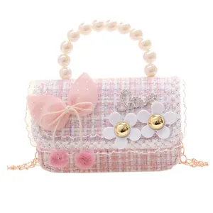 Pink and white tweed girls' pearl handbag with bow and golden chain strap