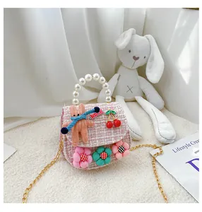 Pink tweed kids crossbody bag with pearl handle, 3D bunny and cherry charms detail