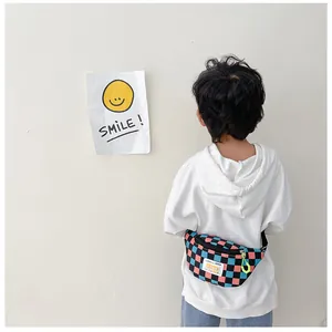 Detail of kids checkered chest bag with ADDR tag and neon zipper on white background