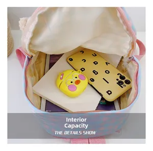 Internal capacity of cartoon bunny backpack with pink and blue plaid pattern design