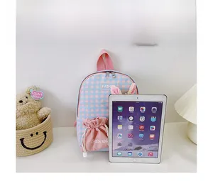 Detail view of pink and blue checkered kids backpack with cute rabbit ears and drawstring pocket